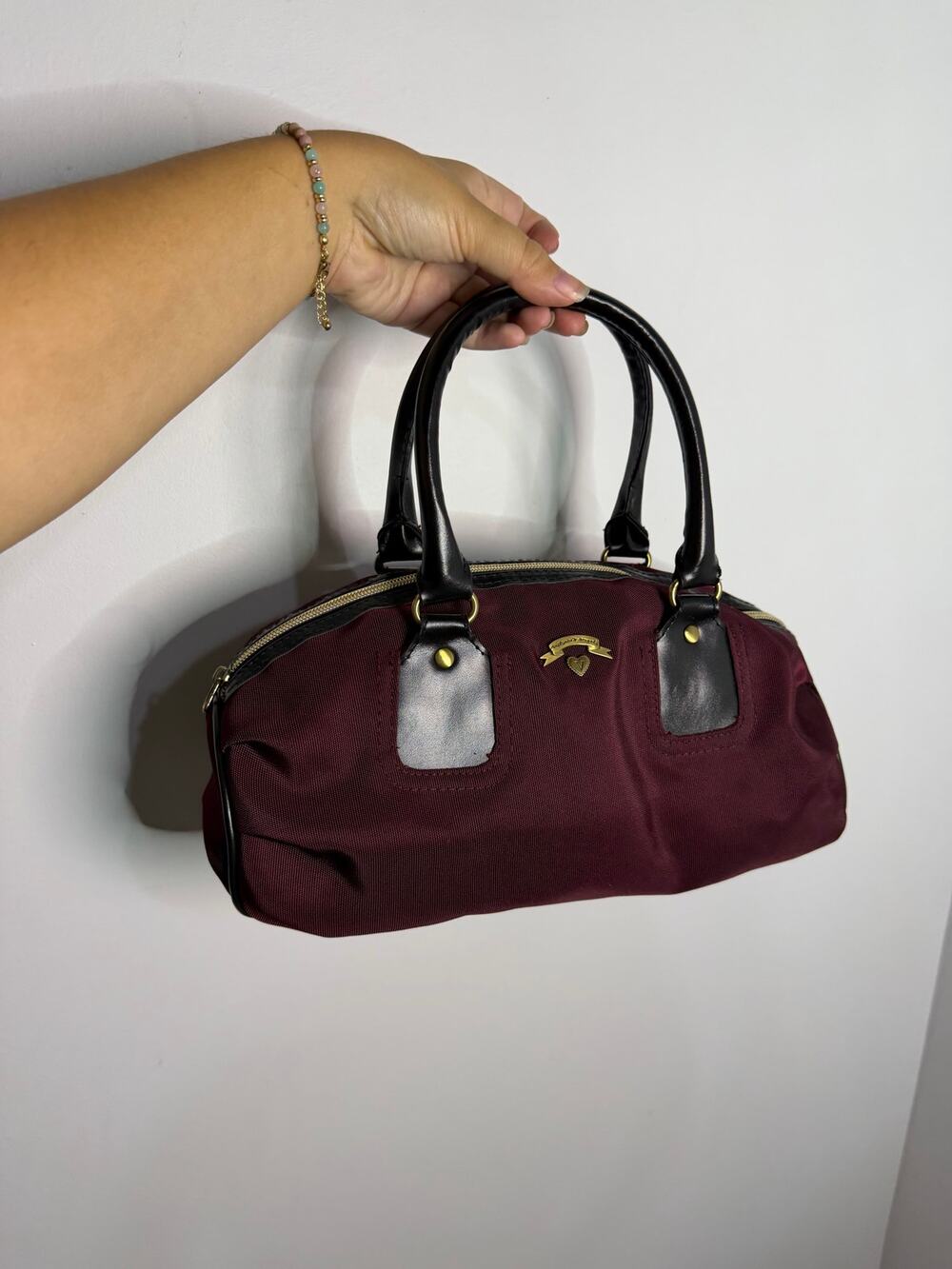 Vintage Victoria's Secret maroon and black mini duffel bag